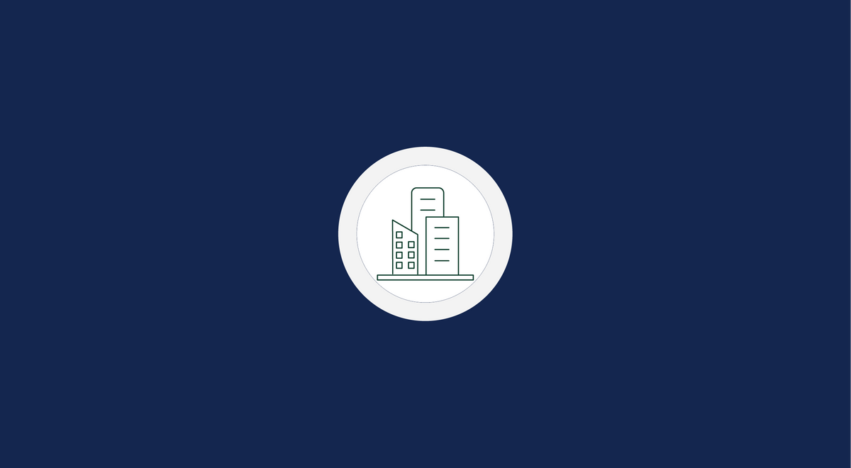Minimalist line icon of city skyscrapers inside a white circle on a dark blue background.